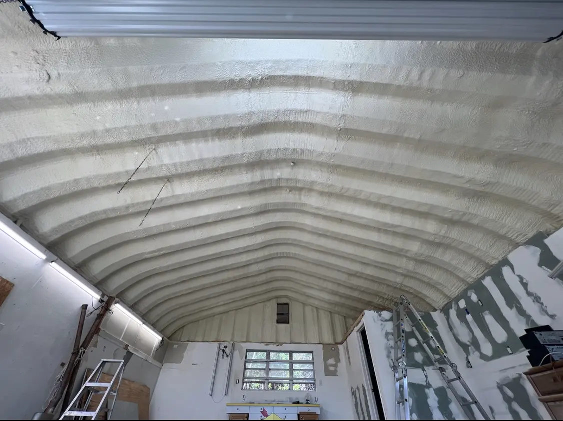 Spray polyurethane foam applied to the underside of a metal roof deck in Alpine